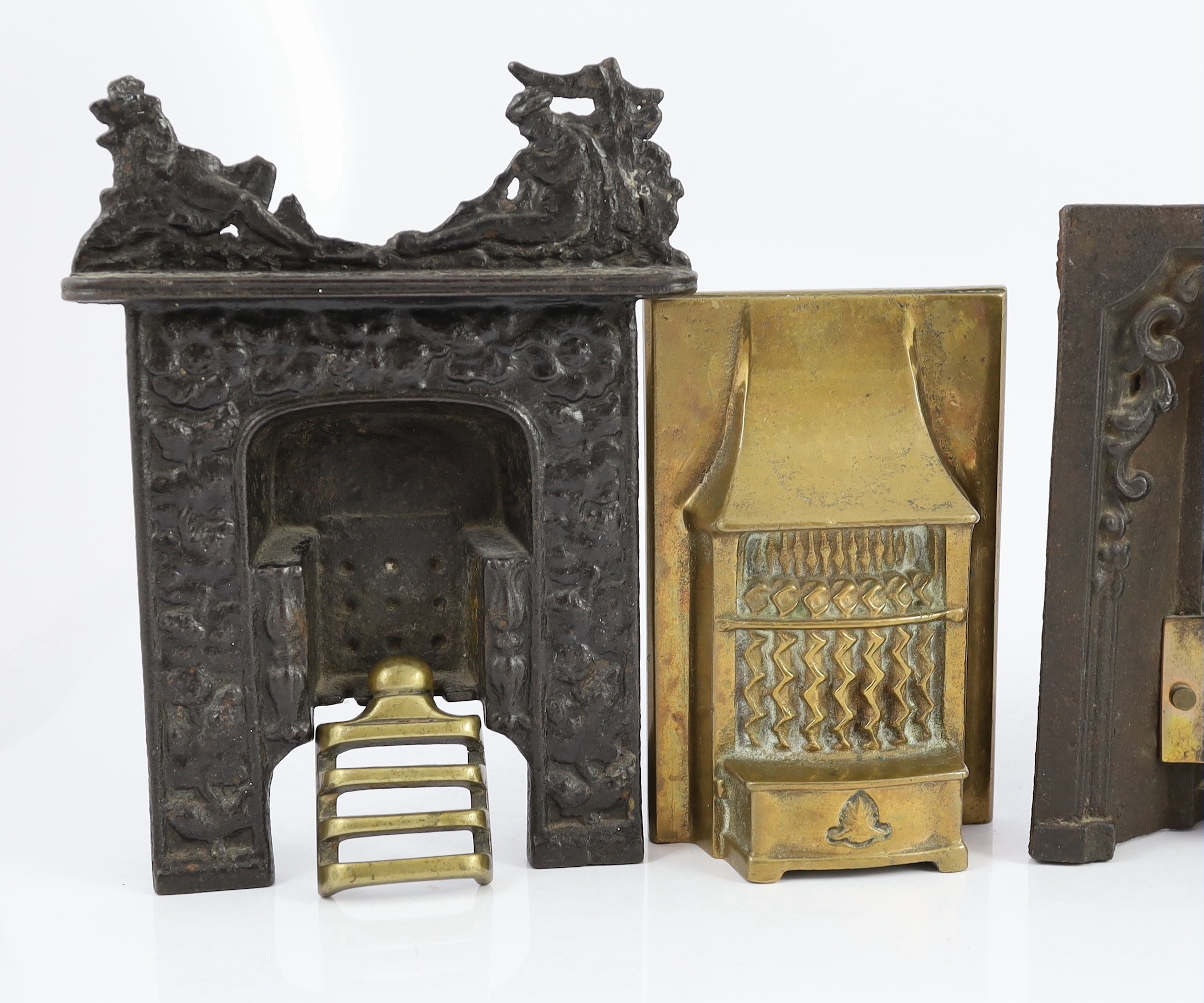 Two Victorian cast iron fire grate models, and two cast brass fire grate models, largest 8in. wide